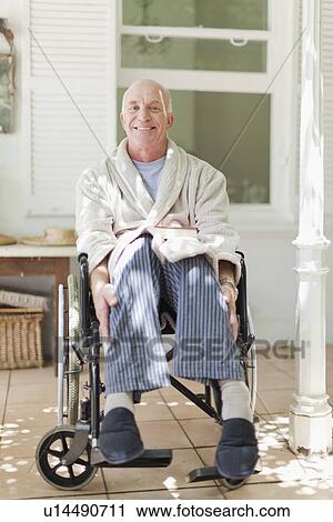 Older man sitting in wheelchair View Large Photo Image Stock Image - Older man sitting in wheelchair. Fotosearch