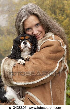 Older woman hugging dog outdoors View Large Photo Image Stock Photography - Older woman hugging dog outdoors. Fotosearch