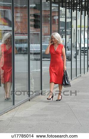 Older woman talking on cell phone View Large Photo Image Picture - Older woman talking on cell phone. Fotosearch