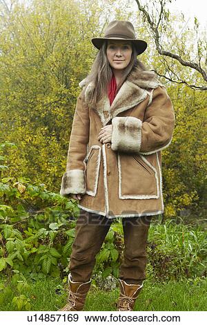 Older woman wearing fur lined coat View Large Photo Image Stock Photo - Older woman wearing fur lined coat. Fotosearch