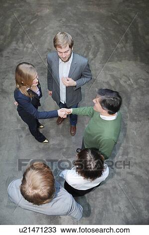 Overhead view of business people View Large Photo Image Stock Image - Overhead view of business people. Fotosearch