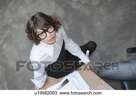 Overhead view of businesswoman on desk View Large Photo Image Stock Image - Overhead view of businesswoman on desk. Fotosearch