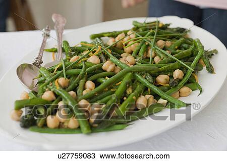 Stock Image - Plate of chickpeas and green beans. Fotosearch