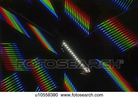 Stock Image - Rainbows reflecting from light. Fotosearch