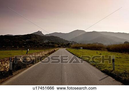 Stock Photograph - Road in hilly rural landscape. Fotosearch