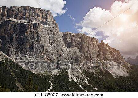 Rocky mountains in rural landscape View Large Photo Image Stock Photo - Rocky mountains in rural landscape. Fotosearch