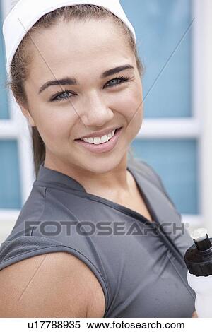 Stock Photography - Runner smiling outdoors. Fotosearch