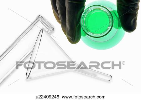 Stock Photography - Scientist holding glowing cylinder. Fotosearch