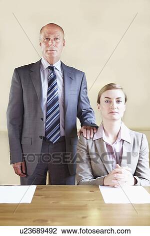 Serious business people in cafe View Large Photo Image Stock Image - Serious business people in cafe. Fotosearch