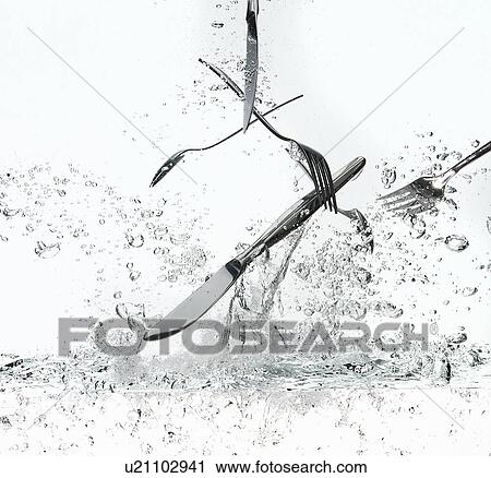 Stock Image - Silverware splashing in water. Fotosearch