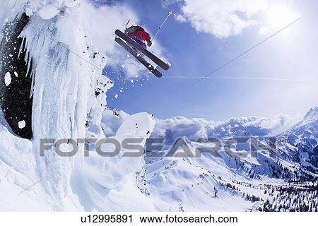 Skier jumping snowy slope View Large Photo Image Stock Image - Skier jumping snowy slope. Fotosearch
