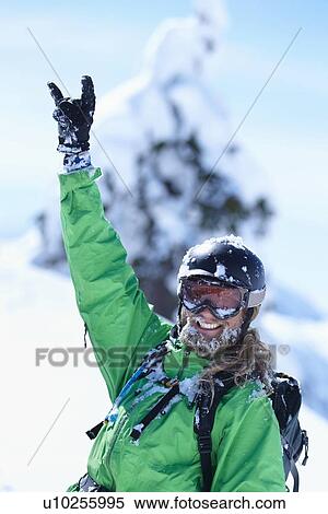 Stock Photography - Skier making hand gesture in snow. Fotosearch
