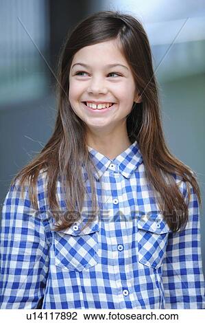 Smiling girl wearing plaid shirt View Large Photo Image Stock Image - Smiling girl wearing plaid shirt. Fotosearch