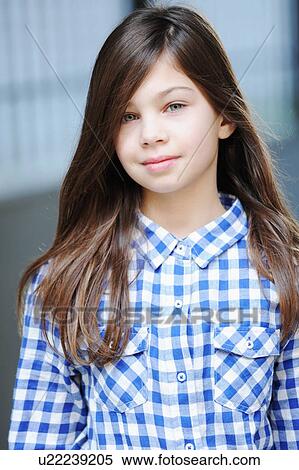 Smiling girl wearing plaid shirt View Large Photo Image Stock Photography - Smiling girl wearing plaid shirt. Fotosearch