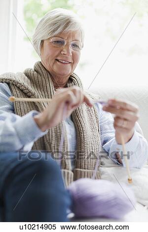 Smiling older woman knitting View Large Photo Image Stock Photography - Smiling older woman knitting. Fotosearch