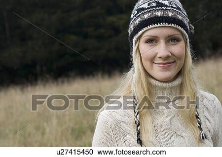 Smiling woman standing outdoors View Large Photo Image Stock Image - Smiling woman standing outdoors. Fotosearch
