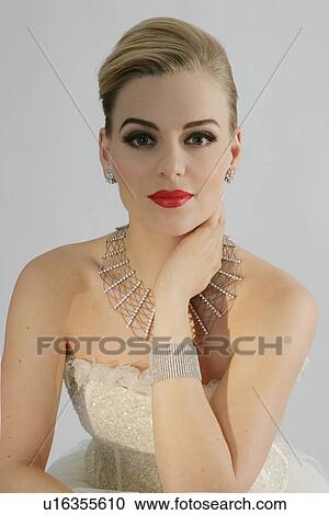 Smiling woman wearing ornate gown View Large Photo Image Stock Image - Smiling woman wearing ornate gown. Fotosearch