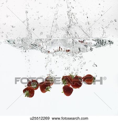 Strawberries splashing in water View Large Photo Image Stock Photo - Strawberries splashing in water. Fotosearch