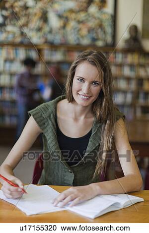 Student studying in library View Large Photo Image Stock Image - Student studying in library. Fotosearch