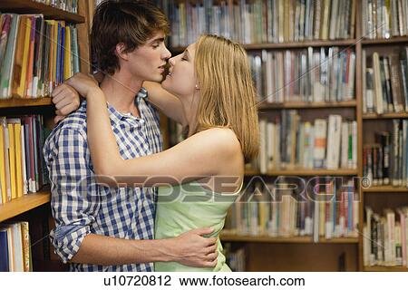 Students kissing in library View Large Photo Image Stock Image - Students kissing in library. Fotosearch