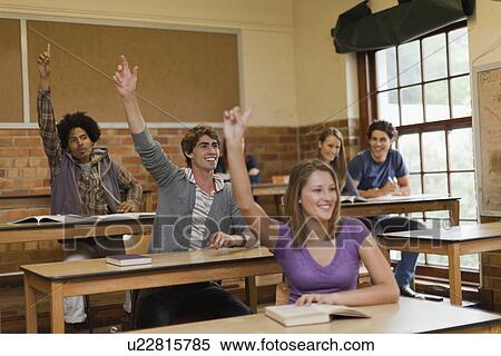 Students raising their hands in class View Large Photo Image Stock Photography - Students raising their hands in class. Fotosearch