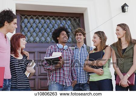 Stock Image - Students talking on campus. Fotosearch