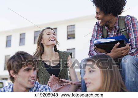 Stock Photo - Students talking on campus. Fotosearch