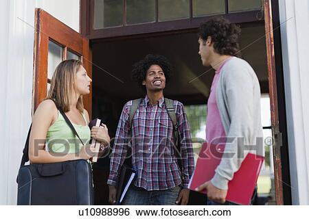 Stock Photograph - Students talking on campus. Fotosearch