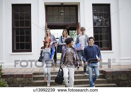 Students walking together on campus View Large Photo Image Stock Photo - Students walking together on campus. Fotosearch