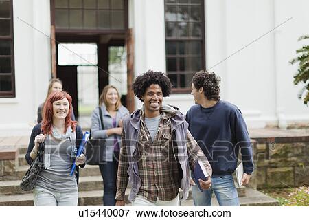 Students walking together on campus View Large Photo Image Stock Photo - Students walking together on campus. Fotosearch