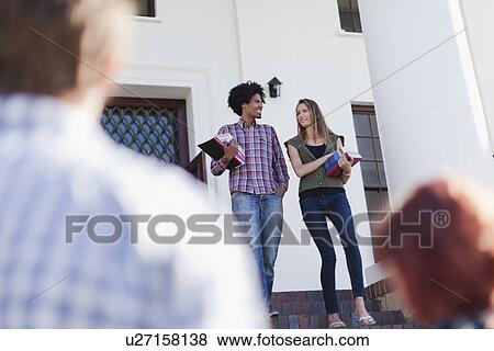Students walking together on campus View Large Photo Image Stock Photo - Students walking together on campus. Fotosearch
