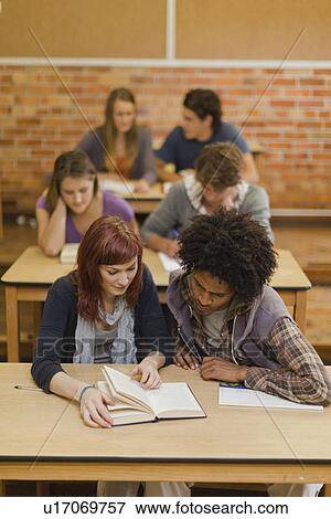 Students working together in class View Large Photo Image Stock Photo - Students working together in class. Fotosearch