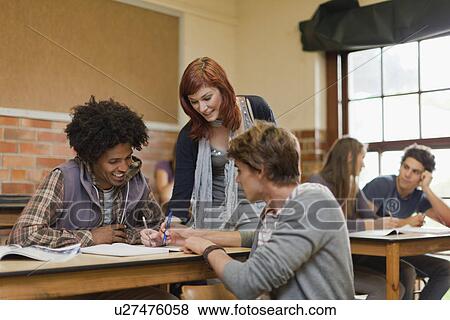 Stock Photo - Students working together in class. Fotosearch