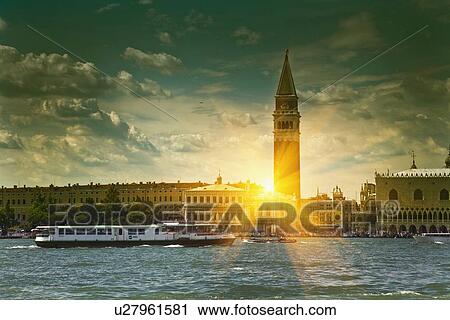 Sun shining through urban buildings View Large Photo Image Stock Image - Sun shining through urban buildings . Fotosearch