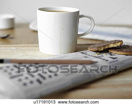 Tea, cookies and crossword on board View Large Photo Image Stock Image - Tea, cookies and crossword on board. Fotosearch