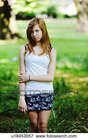 Teenage girl walking in park View Large Photo Image Stock Photo - Teenage girl walking in park. Fotosearch