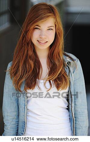 Picture - Teenage girl walking outdoors. Fotosearch