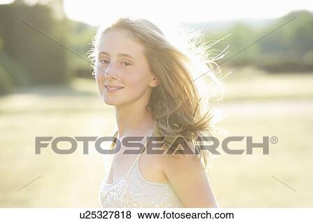 Stock Photo - Teenage girl walking outdoors. Fotosearch