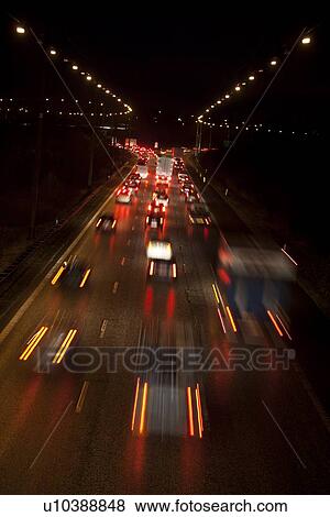 Stock Photo - Time-lapse view of traffic at night. Fotosearch