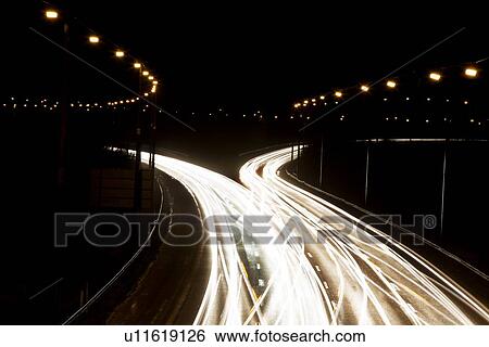 Time-lapse view of traffic at night View Large Photo Image Stock Photograph - Time-lapse view of traffic at night. Fotosearch