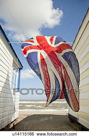Union jack flag blowing in wind View Large Photo Image Stock Photograph - Union jack flag blowing in wind. Fotosearch