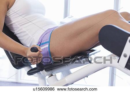 Woman exercising in gym View Large Photo Image Stock Photograph - Woman exercising in gym. Fotosearch