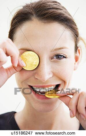 Woman playing with gold coins View Large Photo Image Stock Photo - Woman playing with gold coins. Fotosearch