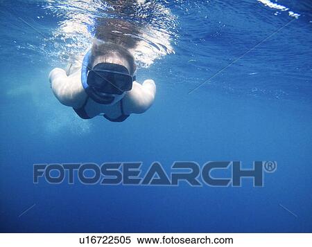 Woman swimming in snorkeling mask View Large Photo Image Stock Photography - Woman swimming in snorkeling mask. Fotosearch
