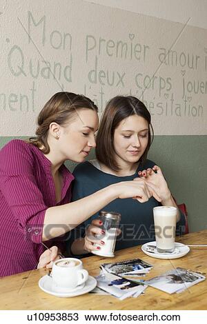 Women having cup of coffee in cafe View Large Photo Image Stock Image - Women having cup of coffee in cafe. Fotosearch
