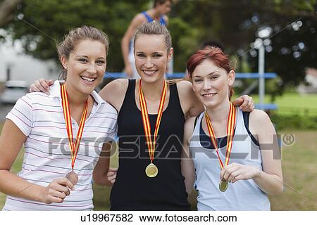 Women wearing medals in park View Large Photo Image Stock Image - Women wearing medals in park. Fotosearch