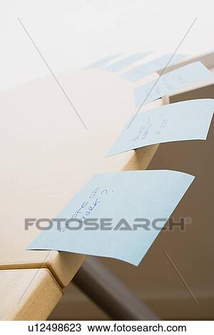 Stock Image - Adhesive notes on desk. Fotosearch