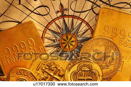 Stock Image - Antique map and coins, studio shot. Fotosearch