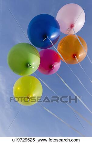 Balloons against blue sky View Large Photo Image Stock Photography - Balloons against blue sky. Fotosearch