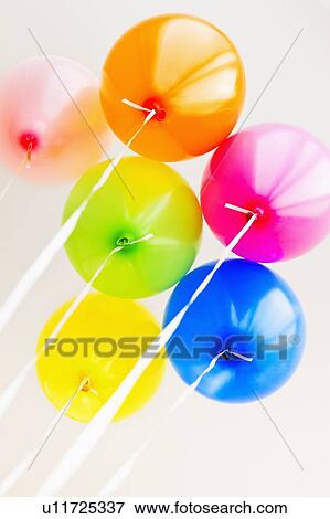Balloons against white background, studio shot View Large Photo Image Stock Photo - Balloons against white background, studio shot. Fotosearch